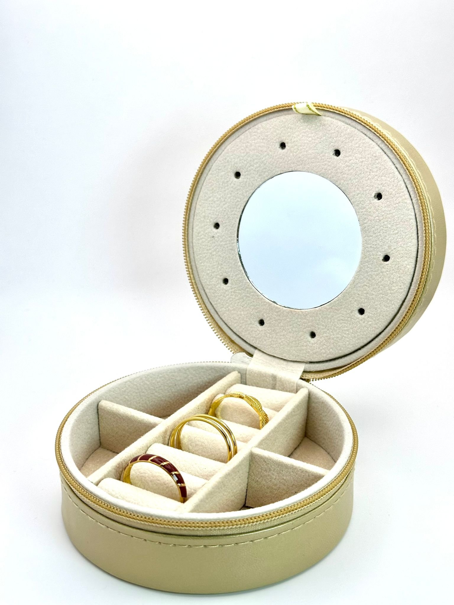 Guarda joias redondo em dourado